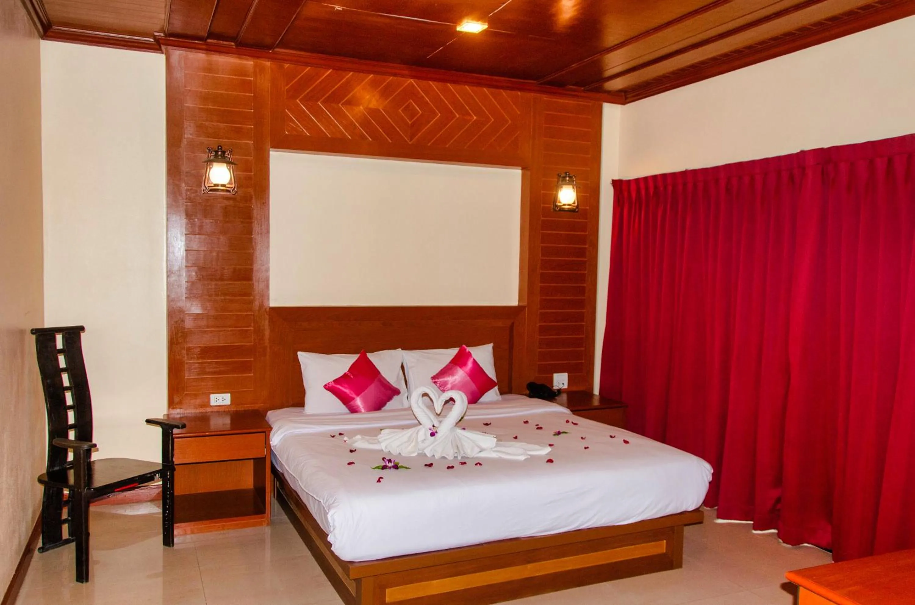 Bed in Diva Patong Hotel