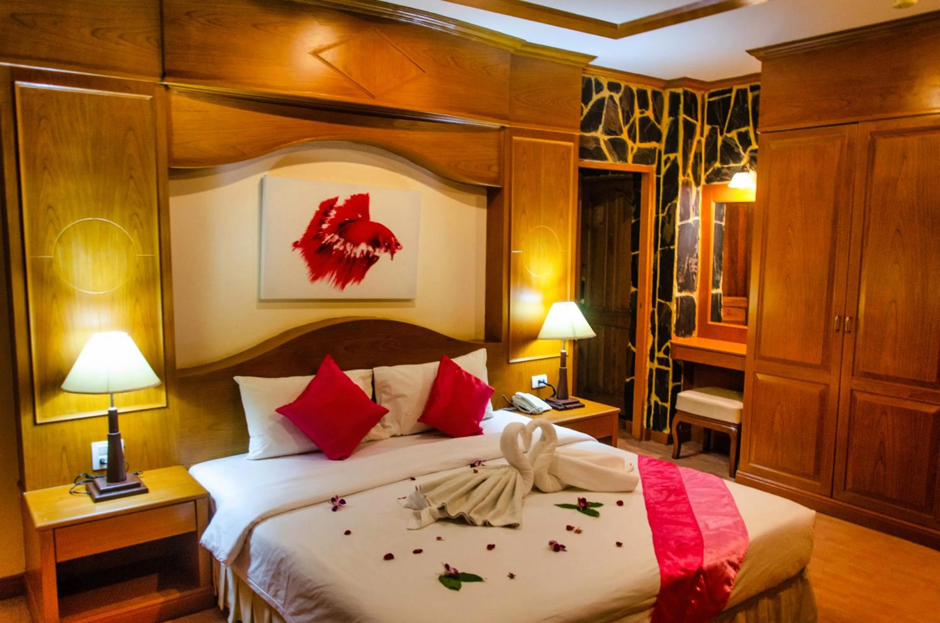 Bed in Diva Patong Hotel