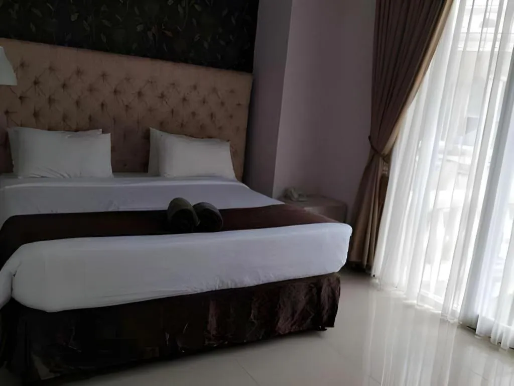 Bed in Rizen Premiere Hotel