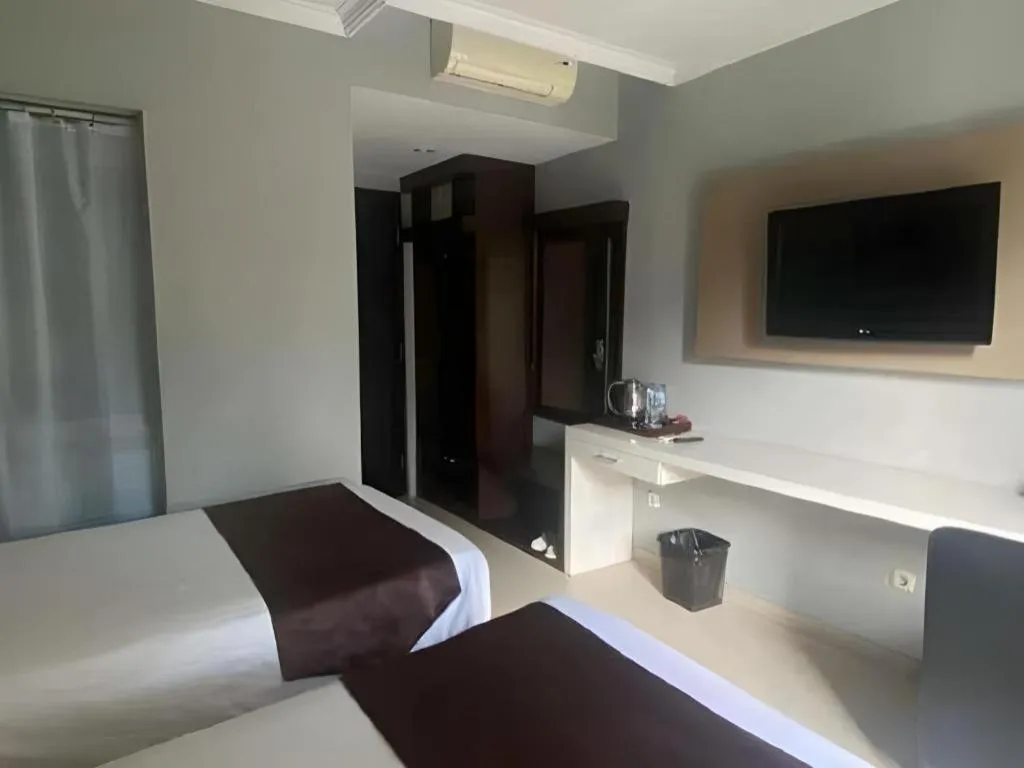 Bed in Rizen Premiere Hotel