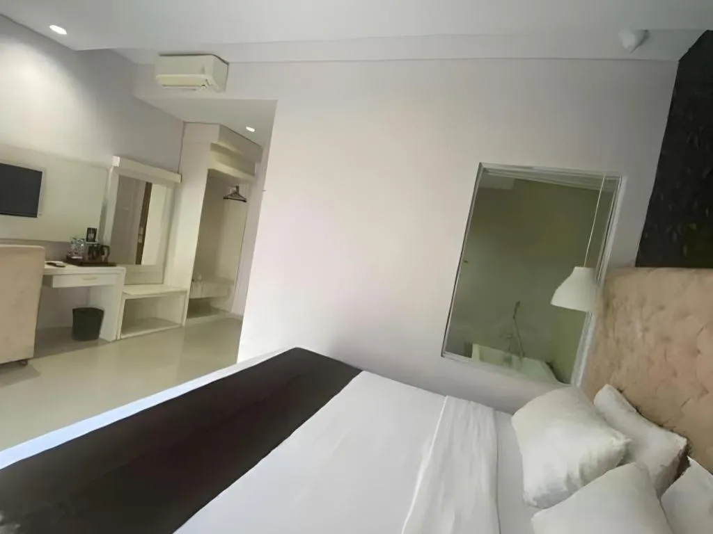 Bed in Rizen Premiere Hotel