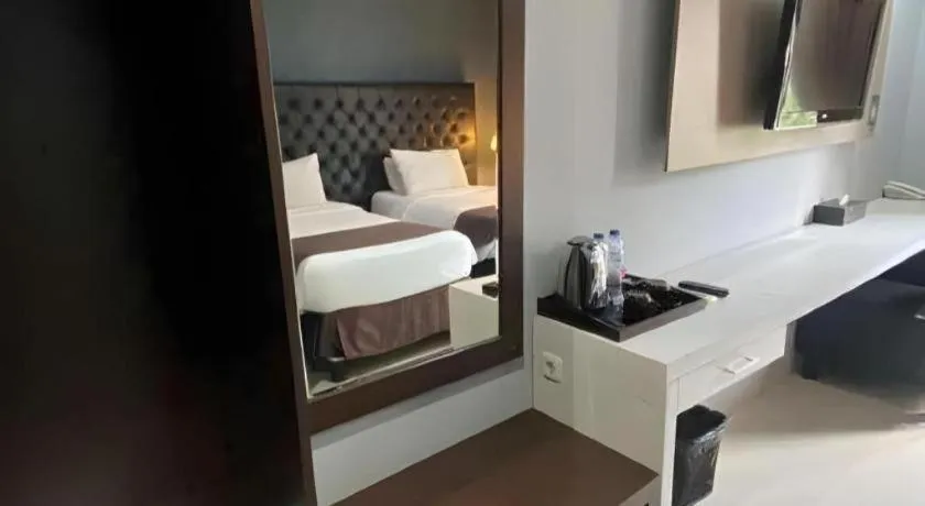 Bed in Rizen Premiere Hotel