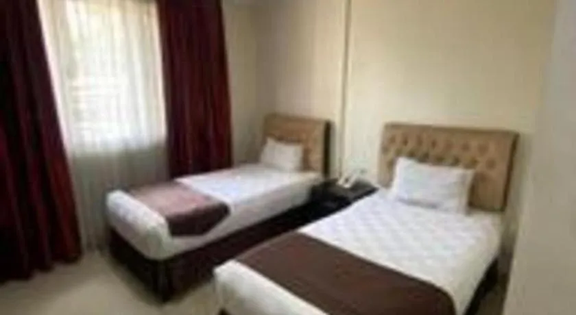 Bed in Rizen Premiere Hotel