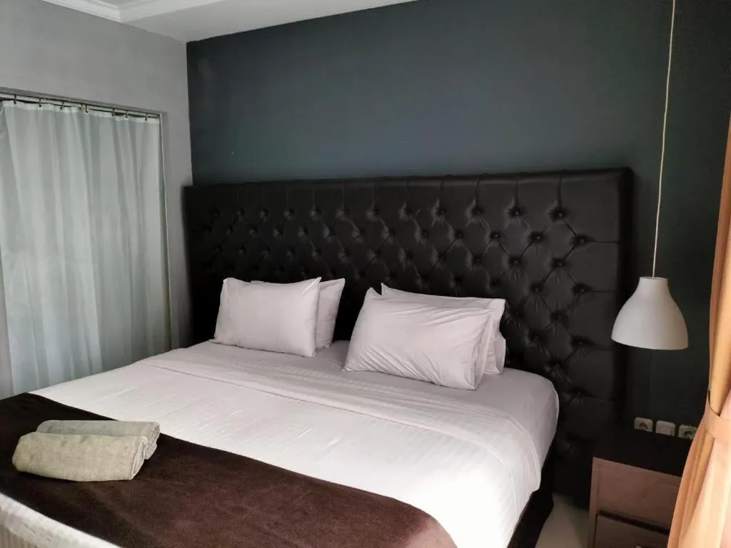 Bed in Rizen Premiere Hotel