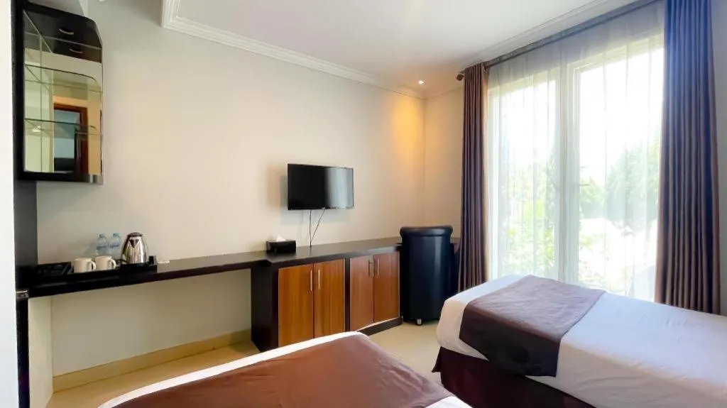 Bed in Rizen Premiere Hotel