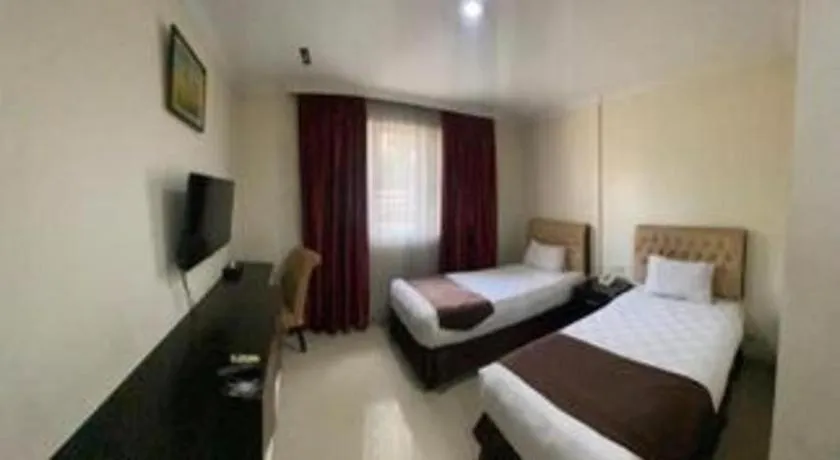 Bed in Rizen Premiere Hotel