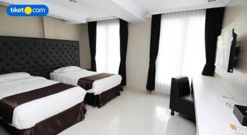 Bed in Rizen Premiere Hotel