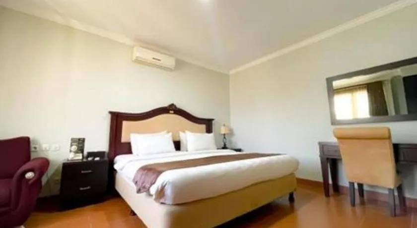 Bed in Rizen Premiere Hotel