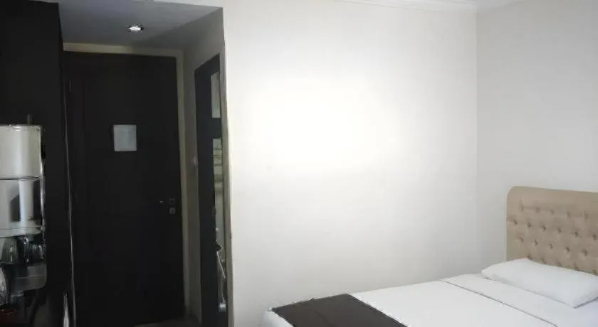 Bed in Rizen Premiere Hotel