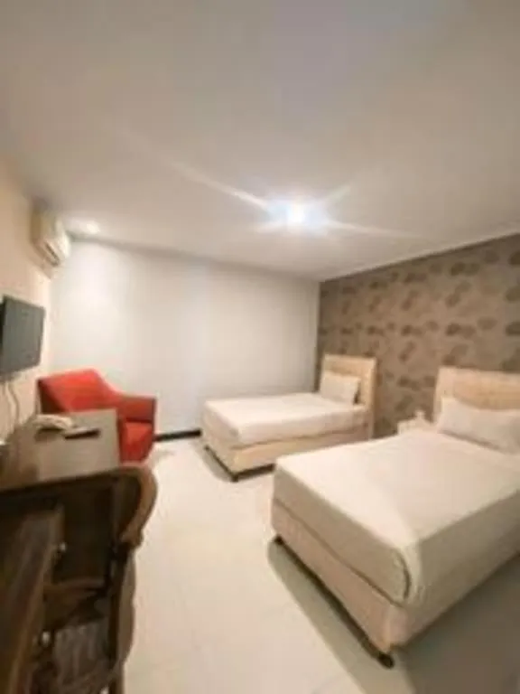 Bed in Rizen Premiere Hotel