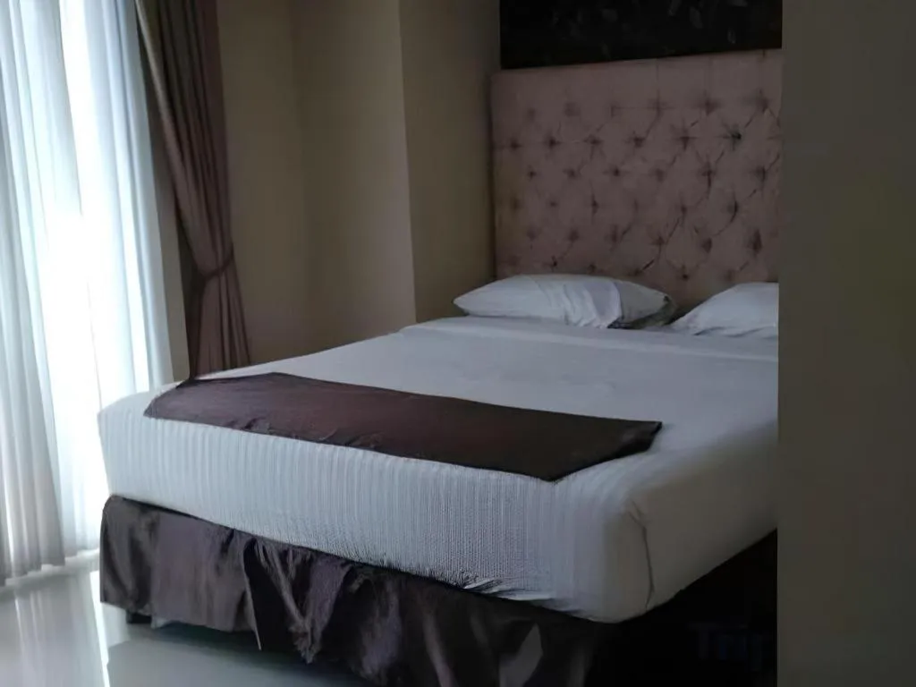 Bed in Rizen Premiere Hotel