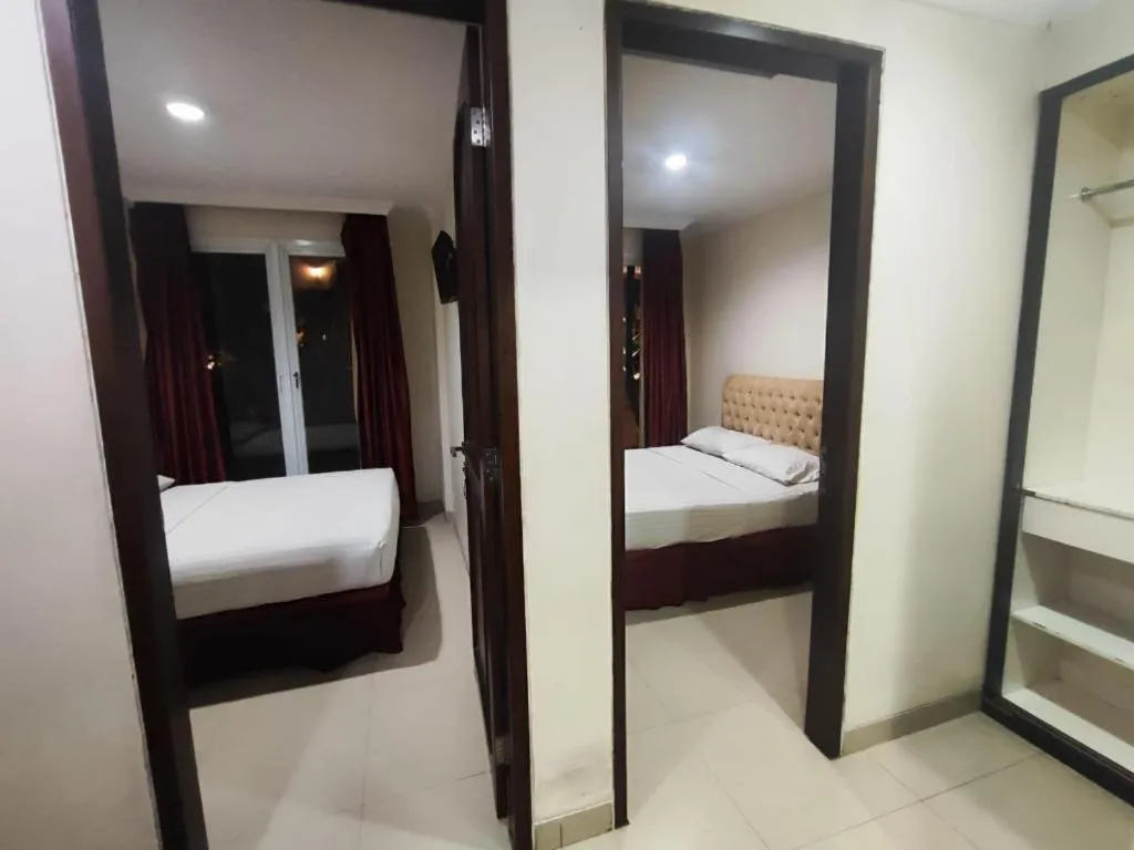 Bed in Rizen Premiere Hotel