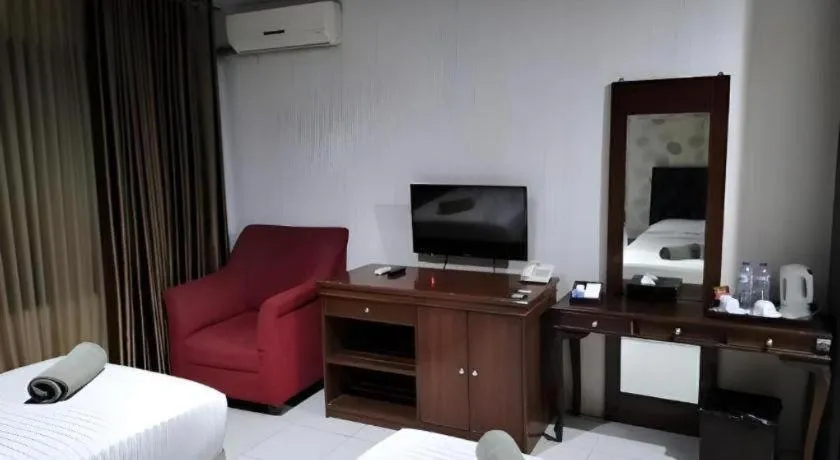 Bed in Rizen Premiere Hotel