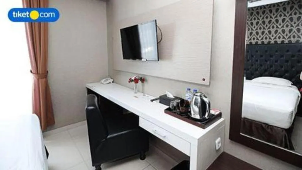 Bed in Rizen Premiere Hotel