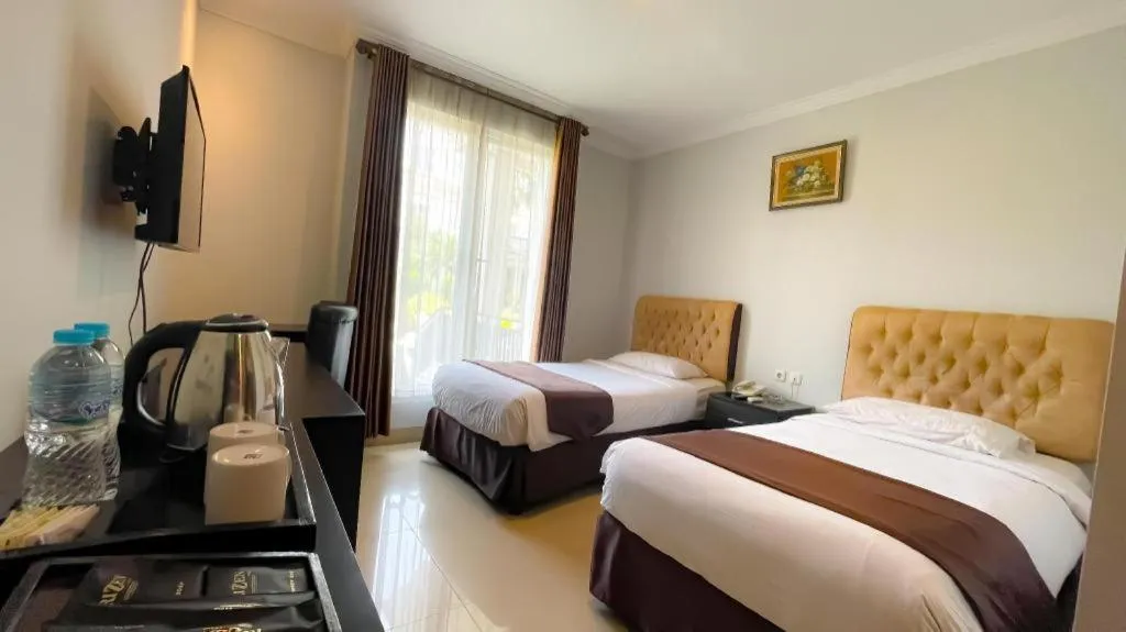 Bed in Rizen Premiere Hotel