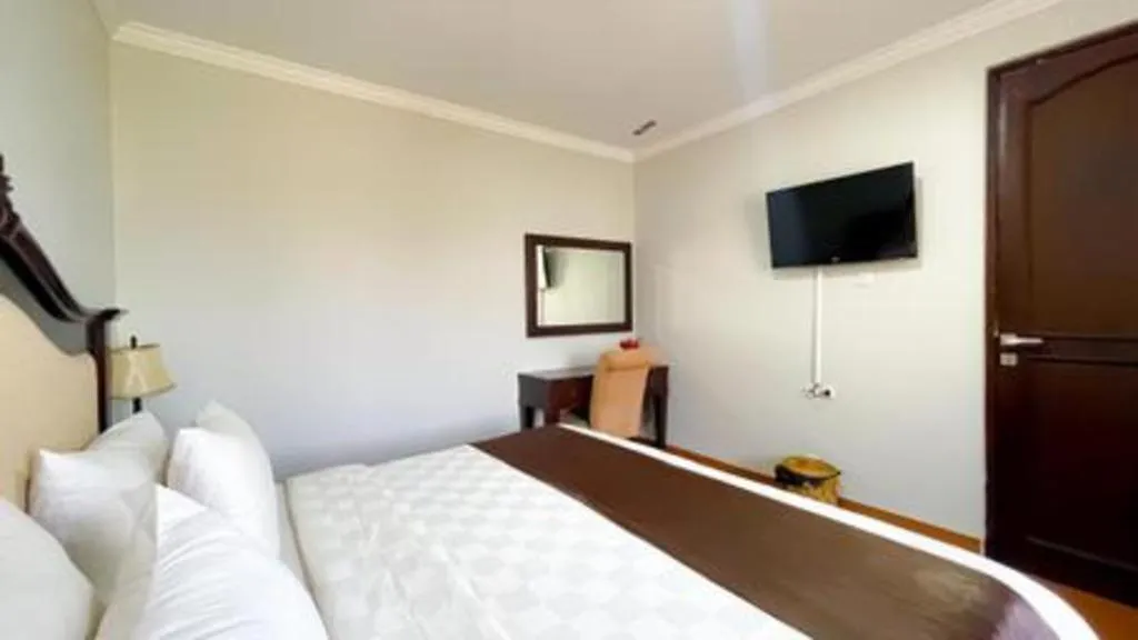 Bed in Rizen Premiere Hotel