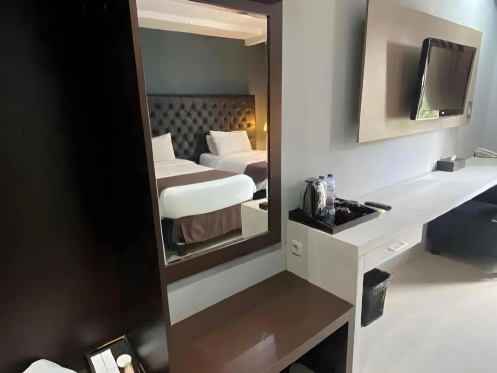 Bed in Rizen Premiere Hotel