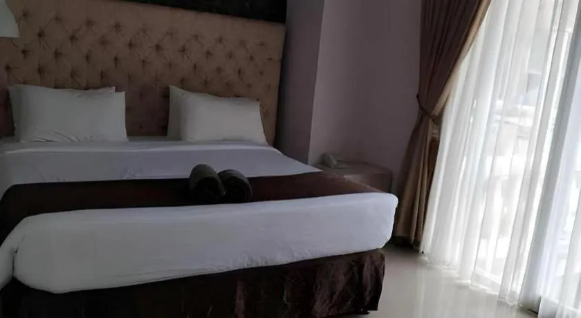 Bed in Rizen Premiere Hotel