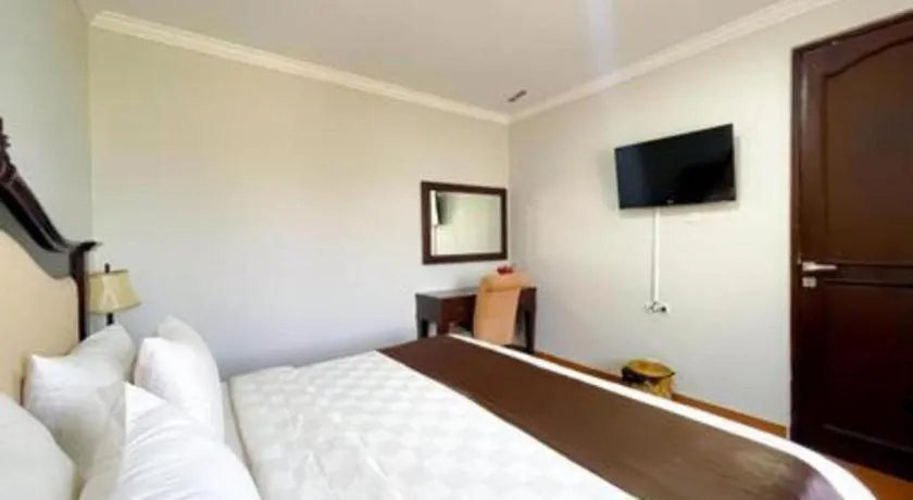 Bed in Rizen Premiere Hotel