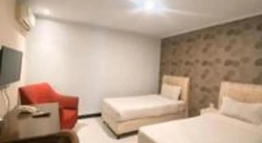 Bed in Rizen Premiere Hotel