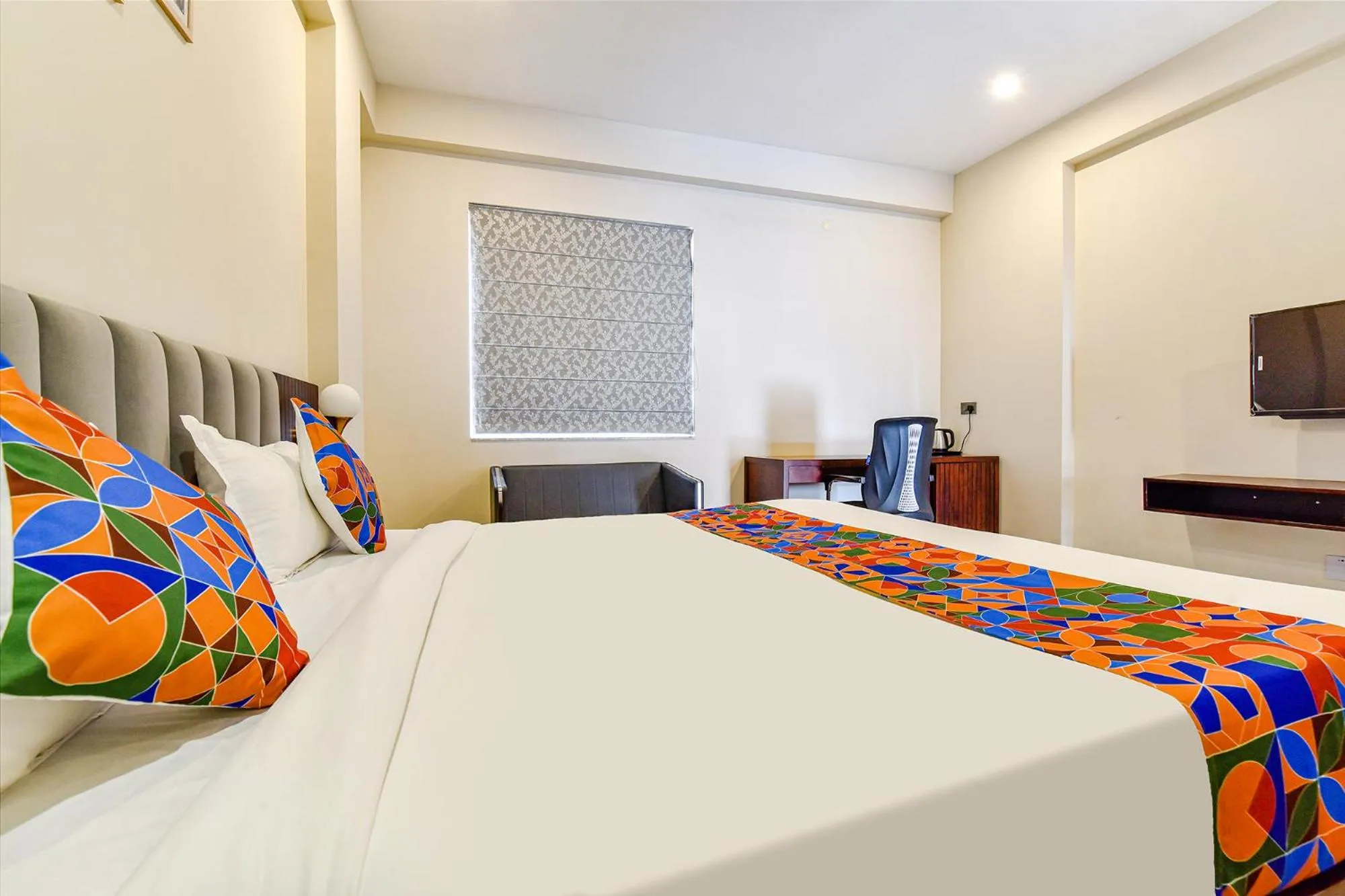 Bed in FabHotel Pravaasam Residency
