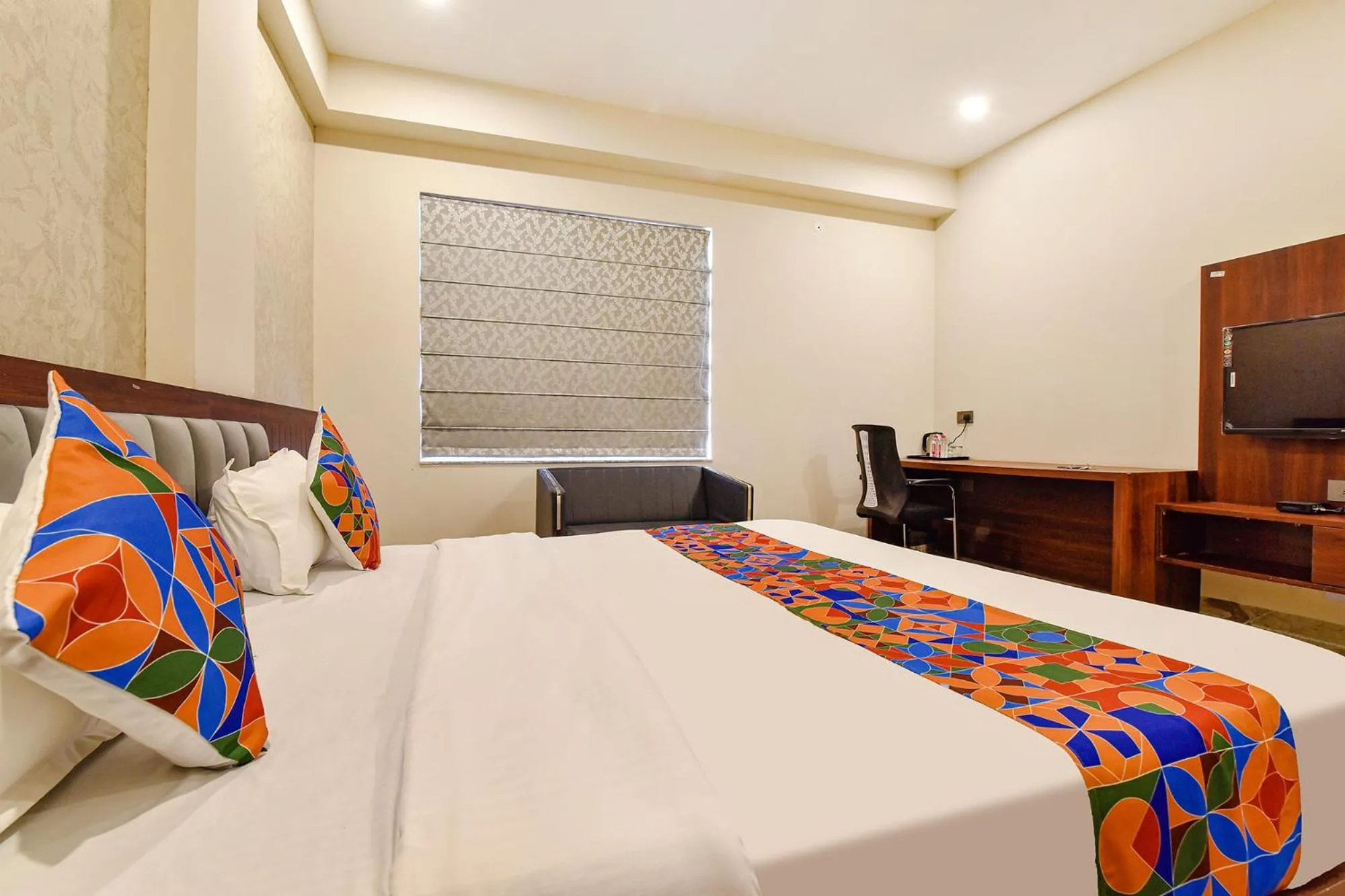 Bed in FabHotel Pravaasam Residency