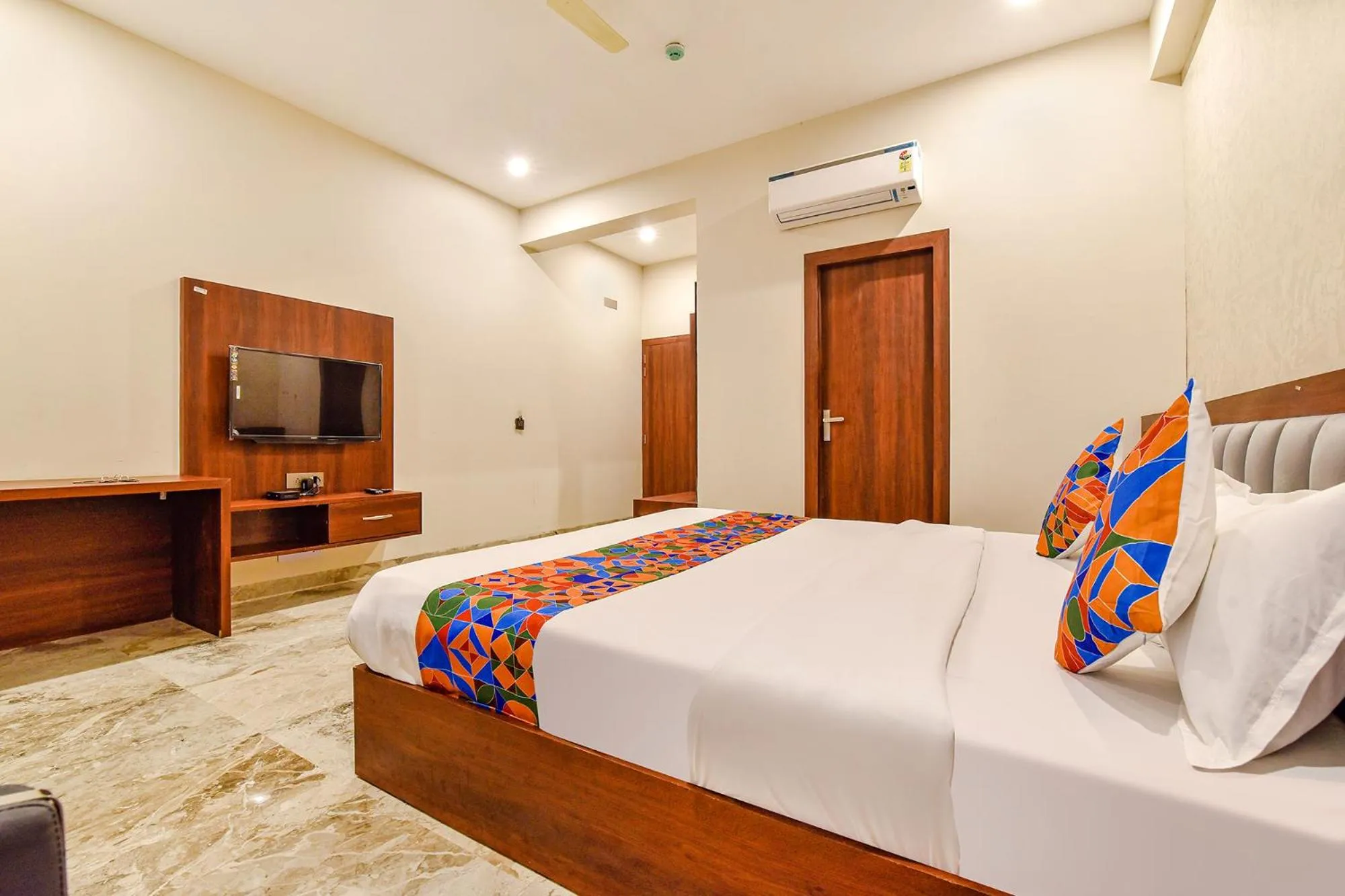 Bed in FabHotel Pravaasam Residency