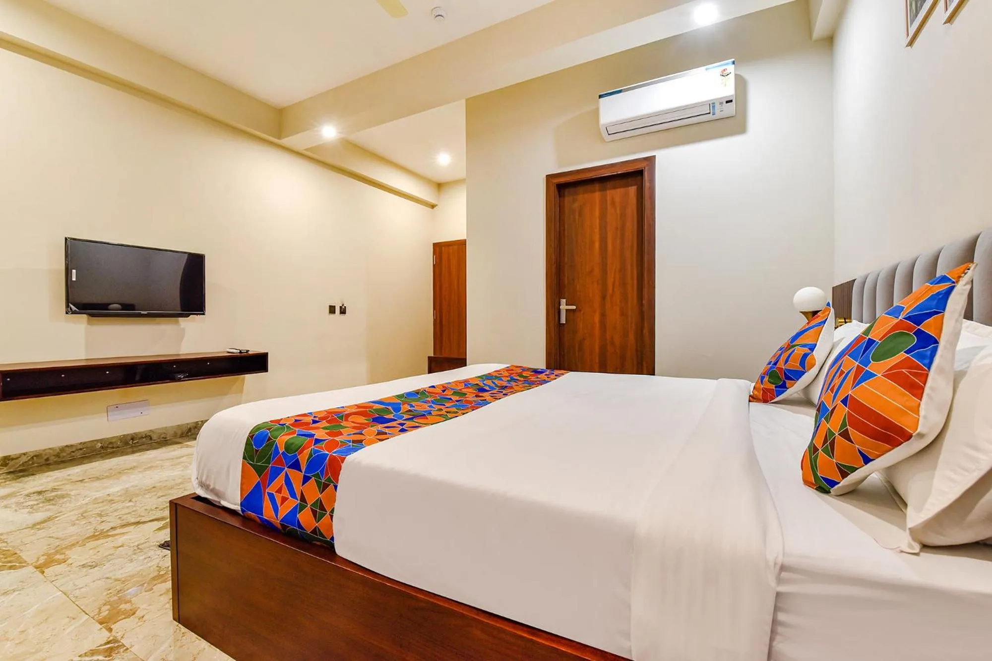 Bed in FabHotel Pravaasam Residency