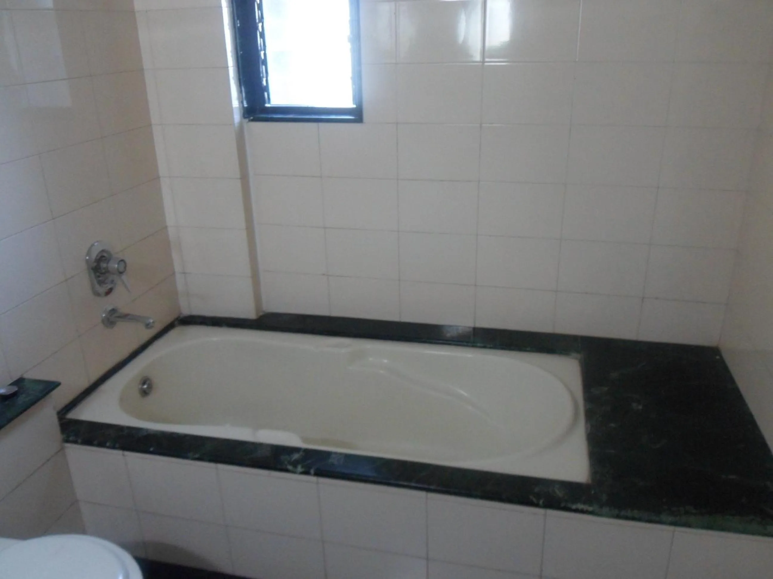 Bathroom in Hotel Pooja International