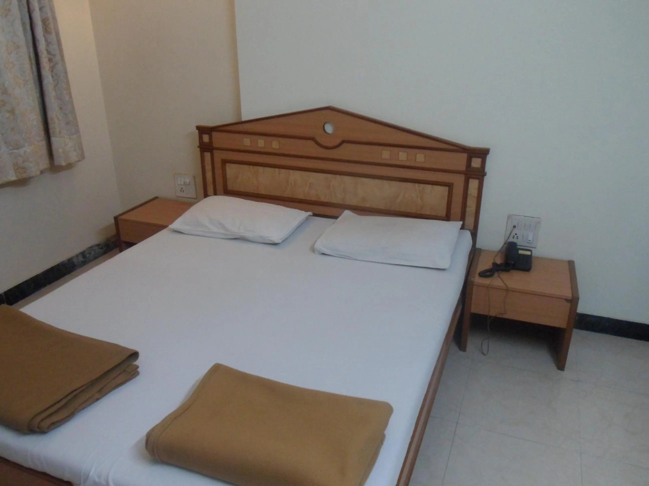 Bed in Hotel Pooja International