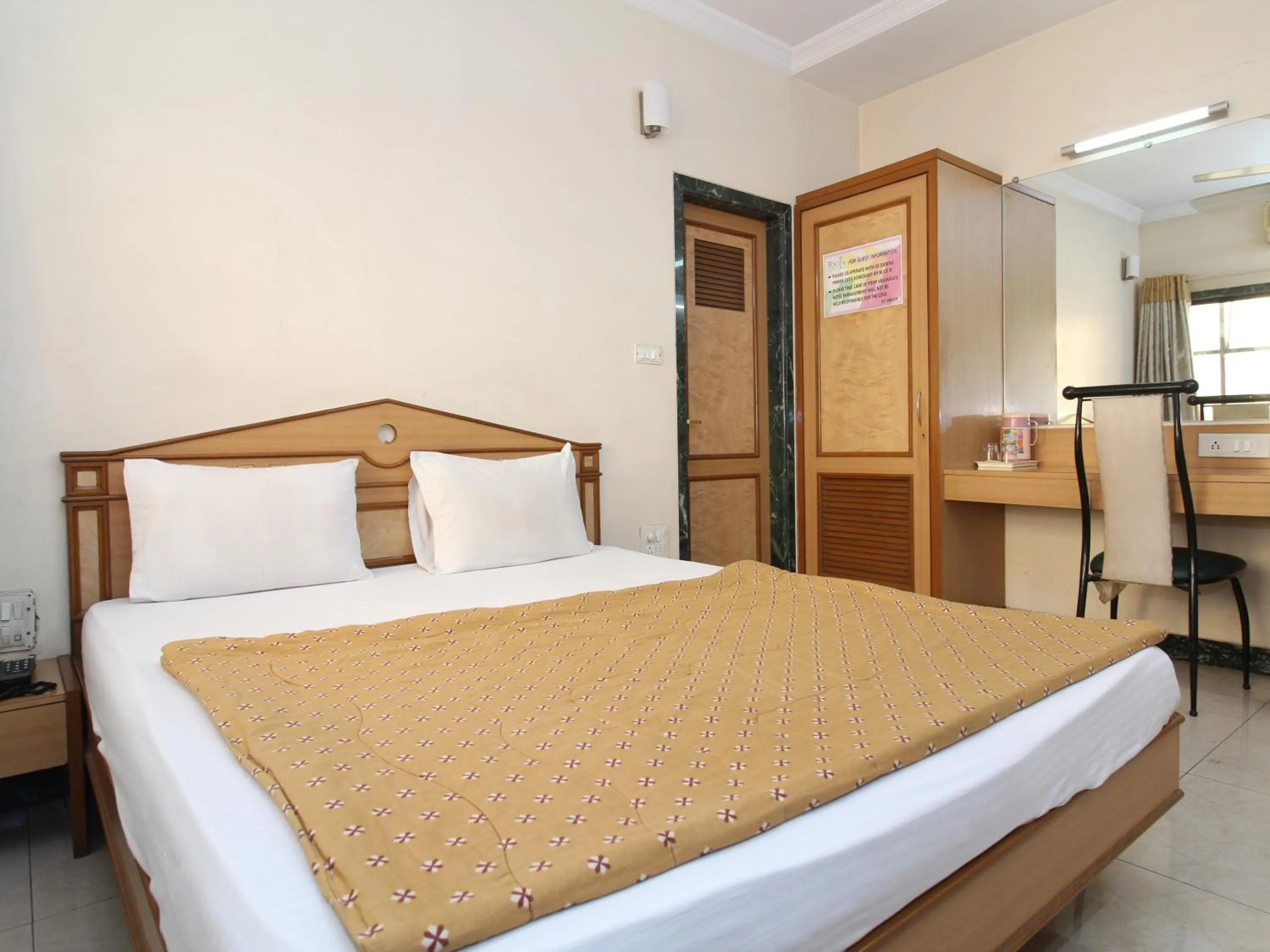 Bed in Hotel Pooja International