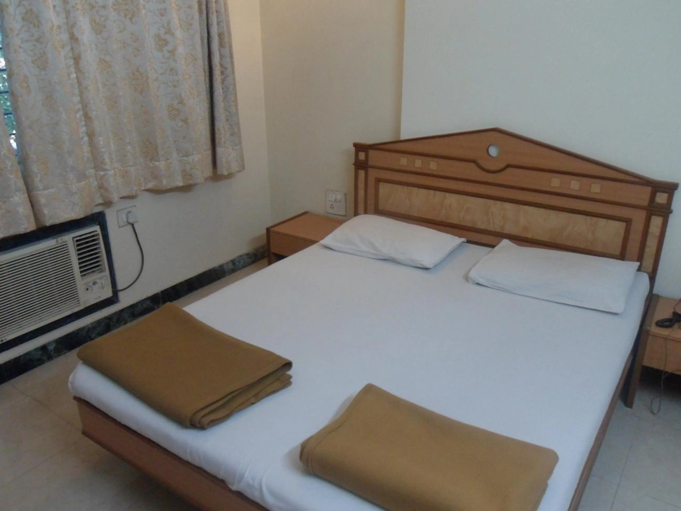 Bed in Hotel Pooja International