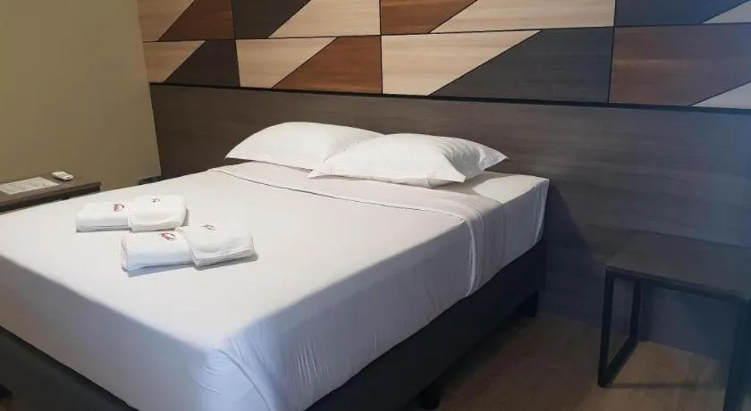 Bed in Travelite Hotel Legarda