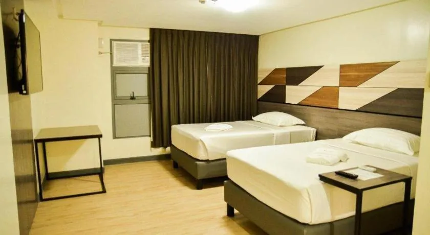 Bed in Travelite Hotel Legarda