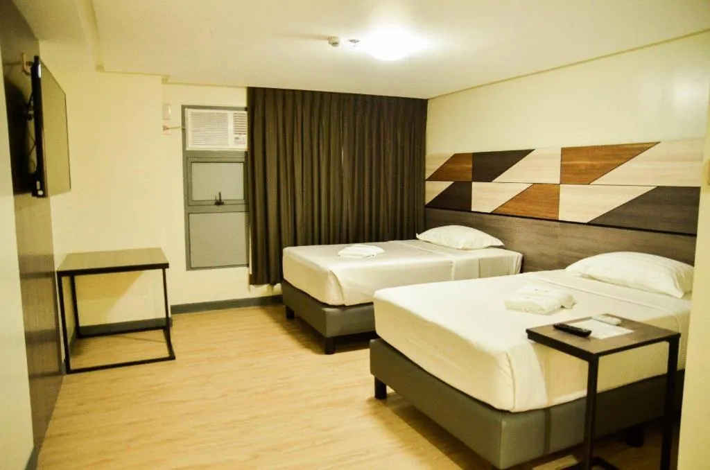Bed in Travelite Hotel Legarda