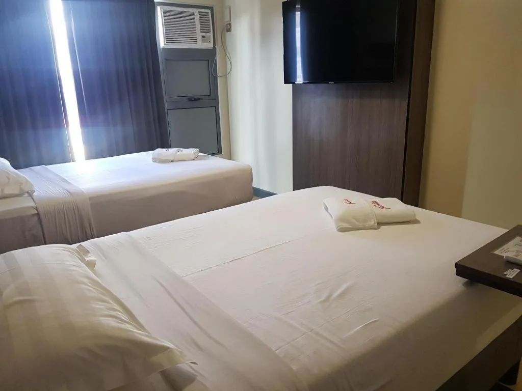 Bed in Travelite Hotel Legarda