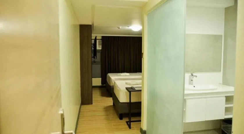 Bed in Travelite Hotel Legarda