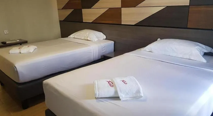 Bed in Travelite Hotel Legarda