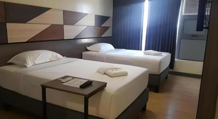 Bed in Travelite Hotel Legarda