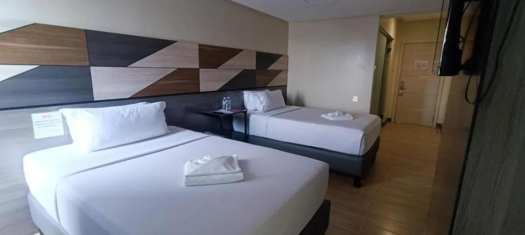 Bed in Travelite Hotel Legarda