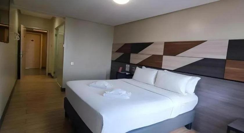 Bed in Travelite Hotel Legarda