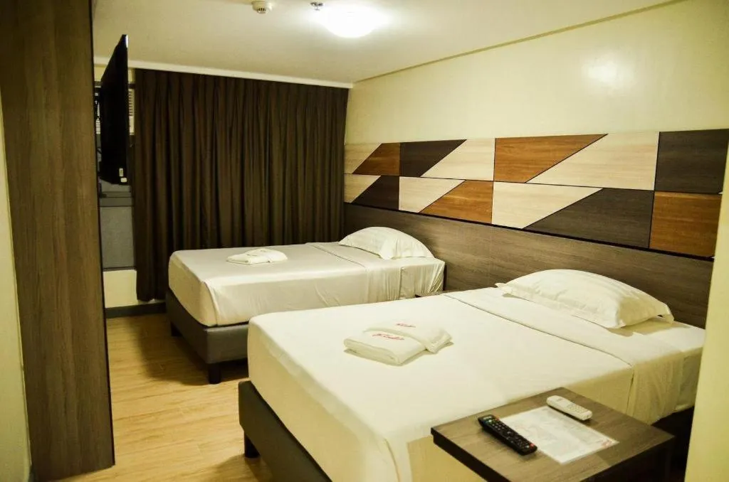 Bed in Travelite Hotel Legarda