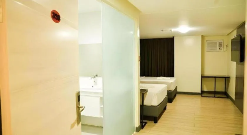 Bed in Travelite Hotel Legarda