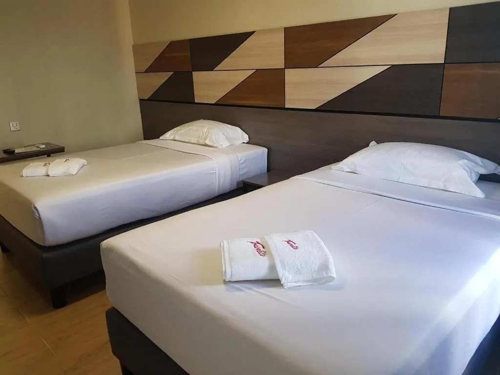 Bed in Travelite Hotel Legarda