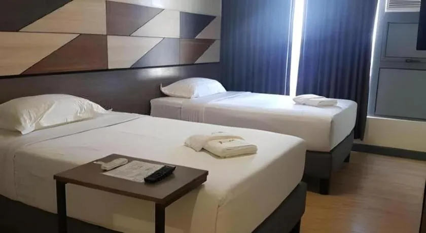 Bed in Travelite Hotel Legarda