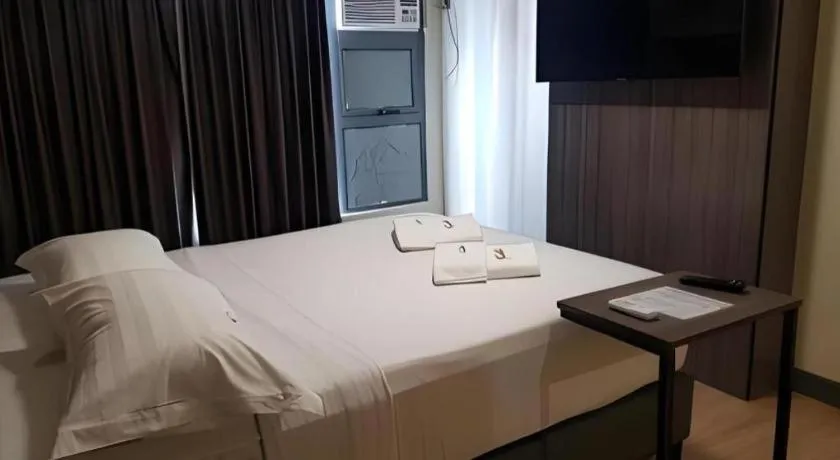 Bed in Travelite Hotel Legarda