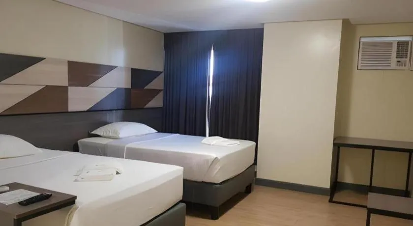 Bed in Travelite Hotel Legarda