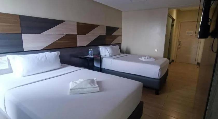 Bed in Travelite Hotel Legarda