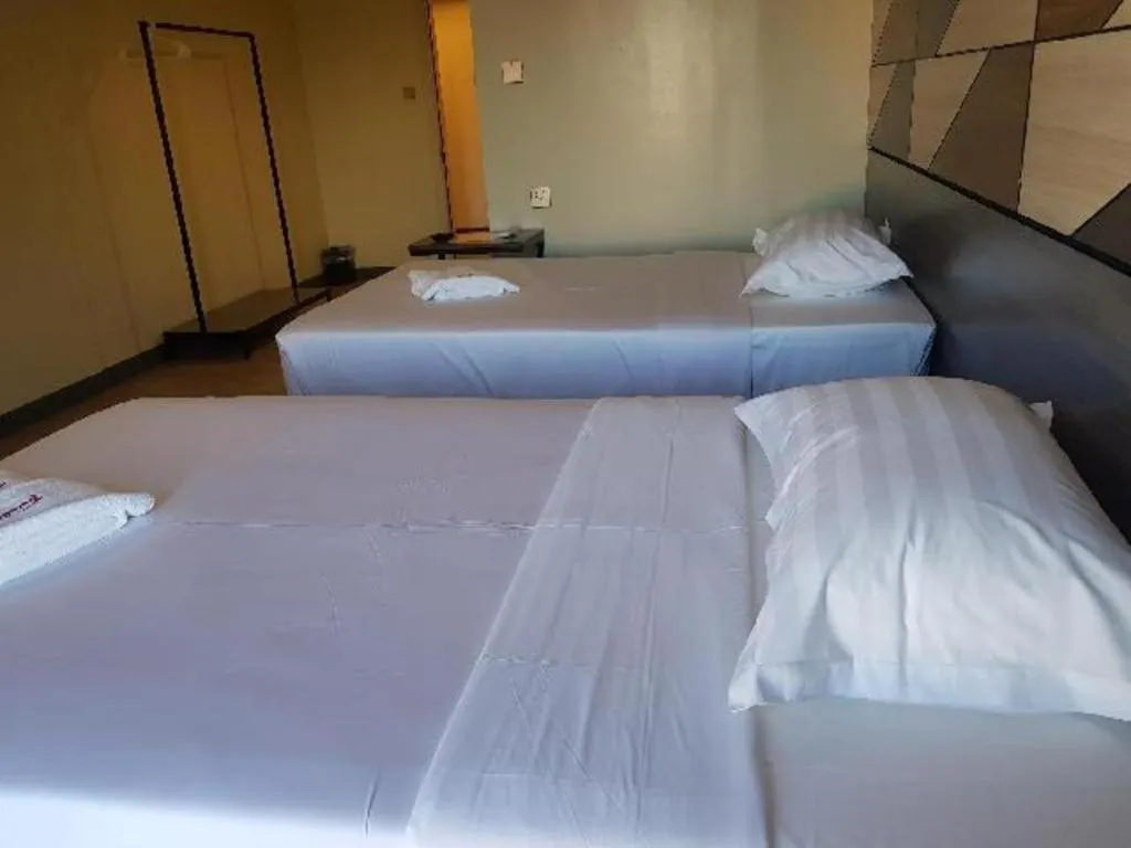 Bed in Travelite Hotel Legarda