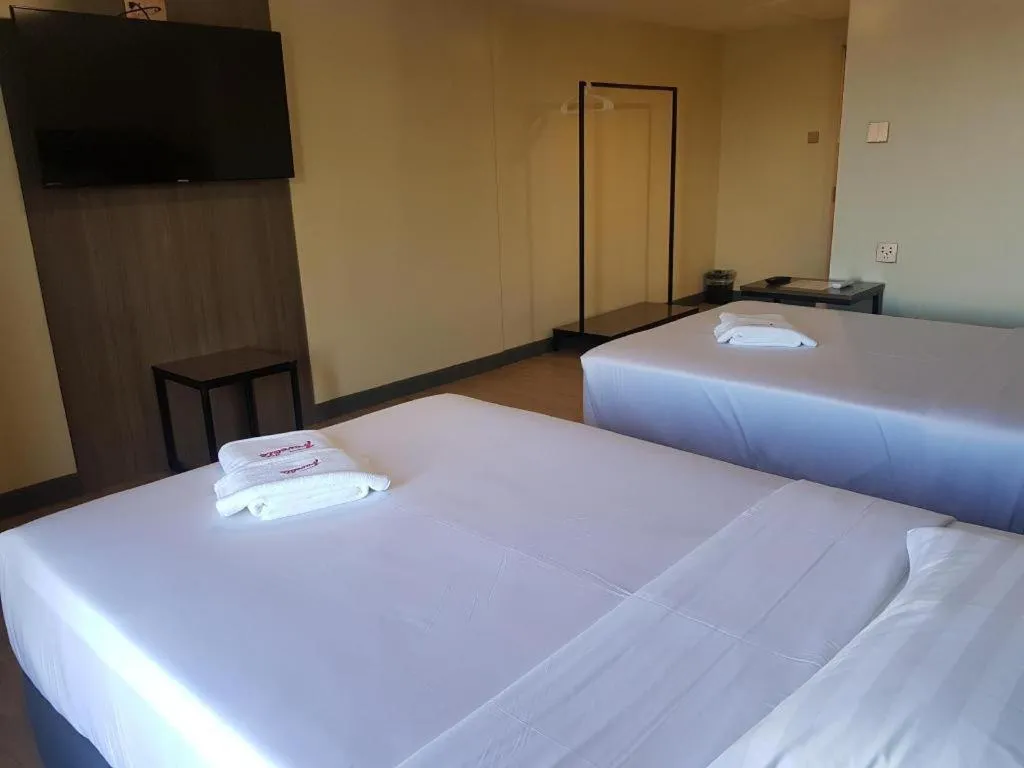 Bed in Travelite Hotel Legarda